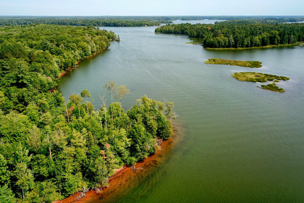 Aerial view of the Chippewa Flowage in summer with winding tree-lined banks.
