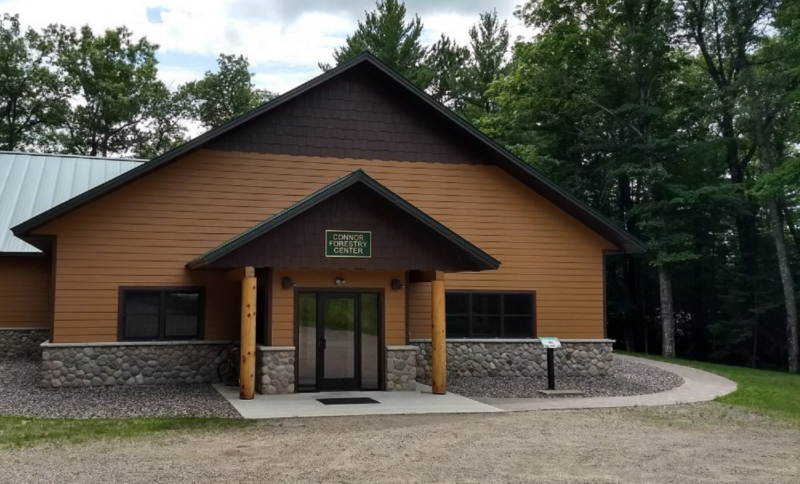 A photograph of the front facade of the Connor Forestry Center building.