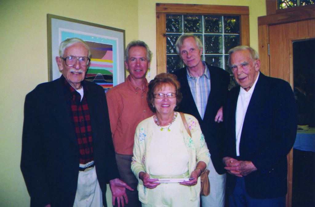 Five people standing together for a photo