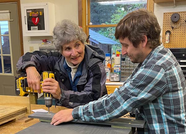 People making a bat house.