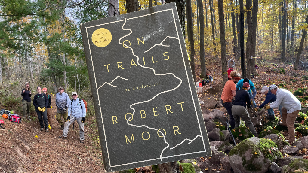 The book On Trails by Robert Moor with a picture of people working on trails behind.